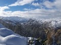 A snowy view of Coronet Peak from the Gondola